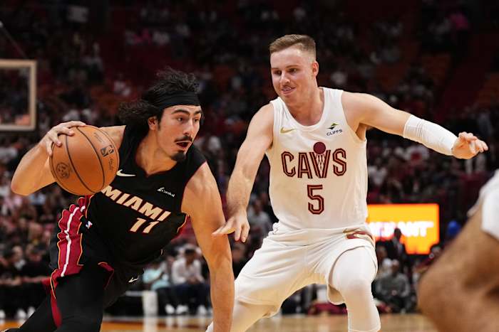 Dec 8, 2023; Miami, Florida, USA; Miami Heat guard Jaime Jaquez Jr. (11) drives the ball around Cleveland Cavaliers guard Sam Merrill (5) during the first half at Kaseya Center. Mandatory Credit: Jasen Vinlove-USA TODAY Sports